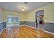 Open dining room with hardwood flooring and sliding glass doors to the backyard at 219 Willow St, Lake Wales, FL 33859