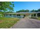 Charming single-story home featuring a covered carport and well-maintained front yard at 219 Willow St, Lake Wales, FL 33859