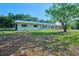 Charming home with a metal roof and an expansive front yard at 219 Willow St, Lake Wales, FL 33859