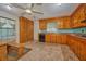 Bright kitchen with knotty wood cabinets, tile backsplash, and lots of natural light at 219 Willow St, Lake Wales, FL 33859