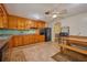 Spacious kitchen featuring knotty wood cabinets, a black appliance package, and eat-in dining area at 219 Willow St, Lake Wales, FL 33859