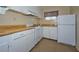 Functional kitchen with white cabinets and plenty of counter space at 219 Willow St, Lake Wales, FL 33859
