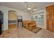 Eat in kitchen with wood table and bench, great ceiling fan, and view to dining room at 219 Willow St, Lake Wales, FL 33859