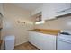 Cozy kitchen featuring white cabinets, butcher block counters and a stove at 219 Willow St, Lake Wales, FL 33859