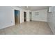 Open layout with tile flooring, connecting living area to kitchen and bath at 219 Willow St, Lake Wales, FL 33859