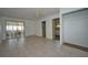 Bright living room featuring tile flooring and access to sunroom at 219 Willow St, Lake Wales, FL 33859