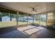 Sunroom with screens, ceiling fan, and backyard views at 219 Willow St, Lake Wales, FL 33859