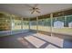 Sunroom with screens, a ceiling fan, and backyard views at 219 Willow St, Lake Wales, FL 33859
