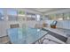 Bright sunroom featuring tile floors, multiple windows, and a table with seating at 219 Willow St, Lake Wales, FL 33859