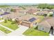 Well-maintained single-Gathering home with a two-car garage, solar panels, and lush landscaping at 249 Haines Blvd, Winter Haven, FL 33881