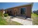 Well-maintained backyard with a sliding door and stone patio at 249 Haines Blvd, Winter Haven, FL 33881