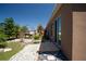 Landscaped backyard featuring a grill, patio, and colorful plants at 249 Haines Blvd, Winter Haven, FL 33881