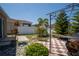 Private backyard featuring a patio with BBQ area, landscaping, and a white vinyl fence at 249 Haines Blvd, Winter Haven, FL 33881