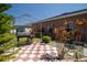 Backyard patio features a checkered tile design and a cozy pergola at 249 Haines Blvd, Winter Haven, FL 33881