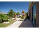 Landscaped backyard featuring a grill, patio, and colorful plants at 249 Haines Blvd, Winter Haven, FL 33881