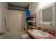 Bright bathroom featuring a shower and bathtub, a large mirror, and marble countertop at 249 Haines Blvd, Winter Haven, FL 33881
