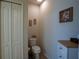 Small bathroom featuring a toilet, vanity, and neutral decor at 249 Haines Blvd, Winter Haven, FL 33881