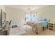 Bright bedroom featuring carpeted floor, ceiling fan and two twin beds with lots of natural light from two windows at 249 Haines Blvd, Winter Haven, FL 33881