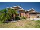 Charming one-story home boasts a well-manicured lawn and colorful landscaping at 249 Haines Blvd, Winter Haven, FL 33881