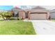 Charming single-story home with well-maintained lawn and tropical landscaping at 249 Haines Blvd, Winter Haven, FL 33881
