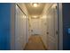 Neutral hallway with storage and doors with access to other parts of the home at 249 Haines Blvd, Winter Haven, FL 33881