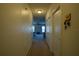 Hallway with neutral walls leading to bedroom and closet at 249 Haines Blvd, Winter Haven, FL 33881