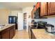 Kitchen featuring stainless steel appliances, granite countertops, and a walk-in pantry at 249 Haines Blvd, Winter Haven, FL 33881