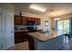 Well-equipped kitchen featuring wood cabinets, a breakfast bar, and stainless steel appliances at 249 Haines Blvd, Winter Haven, FL 33881
