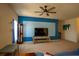 Bright living room featuring plush carpet, ceiling fan, and a stylish accent wall at 249 Haines Blvd, Winter Haven, FL 33881