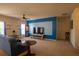 Spacious living room featuring neutral carpet, ceiling fan, and a bold accent wall at 249 Haines Blvd, Winter Haven, FL 33881