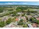 Aerial view showcasing the neighborhood's layout, natural surroundings, and nearby green spaces at 259 Mariposa, Winter Haven, FL 33884