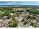 Birds eye view of a residential neighborhood with tree-lined streets, well-kept lawns, and comfortable single-Gathering homes at 259 Mariposa, Winter Haven, FL 33884