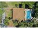 Aerial view of home featuring pool and landscaped grounds at 259 Mariposa, Winter Haven, FL 33884