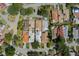 Bird's-eye view featuring rooftops of various homes, mature trees, and winding roads within a well-maintained residential area at 259 Mariposa, Winter Haven, FL 33884