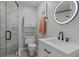 Modern bathroom featuring sleek vanity, lighted mirror and tiled shower at 259 Mariposa, Winter Haven, FL 33884