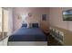 Charming bedroom with soft pink walls, window and comfortable decor at 259 Mariposa, Winter Haven, FL 33884
