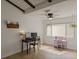 Bright room featuring wood floors, a ceiling fan and desk setup to be used as a bedroom or workspace at 259 Mariposa, Winter Haven, FL 33884
