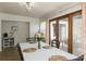 Dining area features sliding glass doors to a screened patio, perfect for enjoying indoor-outdoor living at 259 Mariposa, Winter Haven, FL 33884