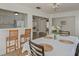 Cozy dining area with a table, seating, and an adjacent breakfast bar, ideal for casual meals at 259 Mariposa, Winter Haven, FL 33884