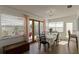 Bright dining room featuring a wooden table with seating for six and sliding door access to a patio at 259 Mariposa, Winter Haven, FL 33884