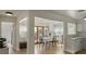 Open dining room with hardwood floors, chandelier, and natural light from windows and sliding glass door at 259 Mariposa, Winter Haven, FL 33884