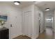 Bright entryway with hardwood floors, a closet, and white walls leading into the home at 259 Mariposa, Winter Haven, FL 33884