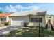 The front exterior shows a well-maintained home with a driveway and well-manicured lawn at 259 Mariposa, Winter Haven, FL 33884