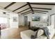 Spacious living room with vaulted ceiling, wood floors, white sofas, and view to other rooms at 259 Mariposa, Winter Haven, FL 33884