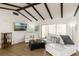 Open-concept living room with wood floors, vaulted ceiling, comfortable seating and view to the courtyard at 259 Mariposa, Winter Haven, FL 33884