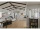 Spacious living room with vaulted ceiling, exposed beams, wood floors, and a modern design at 259 Mariposa, Winter Haven, FL 33884