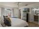 Bright main bedroom with private patio access and en-suite bathroom at 259 Mariposa, Winter Haven, FL 33884