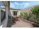 Relaxing brick-paved patio with a table and chairs, providing a cozy outdoor dining space at 259 Mariposa, Winter Haven, FL 33884