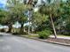 Quiet street view with mature trees and landscaping at 259 Mariposa, Winter Haven, FL 33884