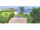 Aerial view of lakeside house with direct lake access and boat dock at 2611 State Road 557, Lake Alfred, FL 33850